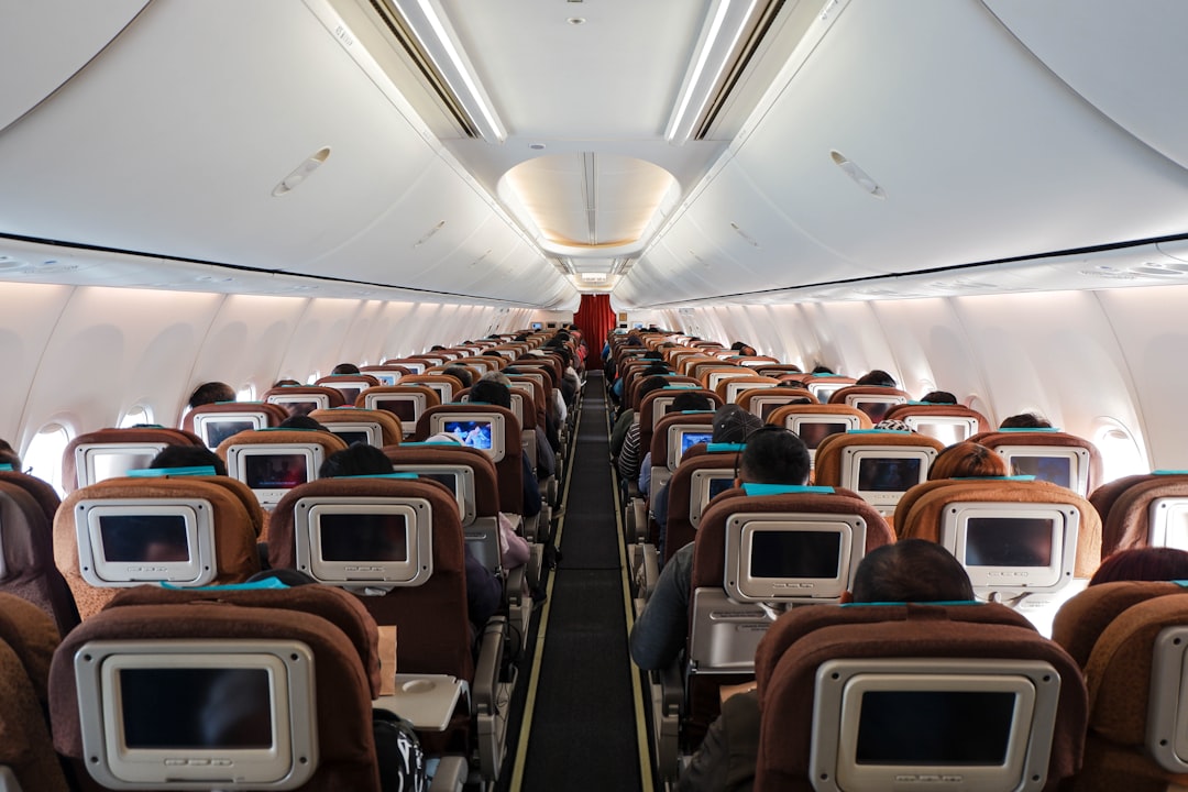 A clean and organized aircraft cabin with plush seating and bright lighting, showcasing a fresh and inviting atmosphere for passengers.